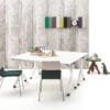 landscapexl Gispen Dukdalf folding tables with Triennial Classic chairs and Bor sidetable with Asy serving tray in front of concrete backpanel front view
